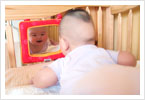 Kiera laughing at her mirror