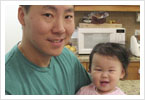 (Uncle Victor bribing Kiki's attention with a cell phone)